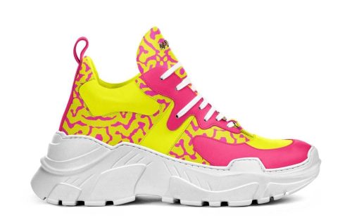 Defense P002 chunky sneaker in neon yellow and pink with abstract patterns, thick white sole, side view.
