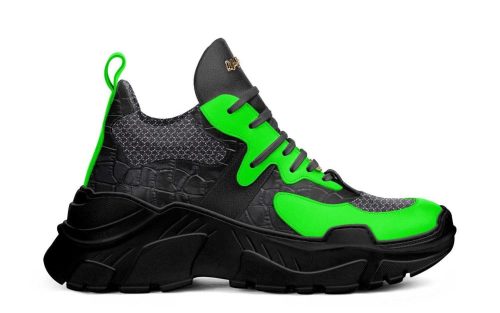 Battle P006 sneaker featuring a chunky black sole, textured dark upper, and vibrant neon green accents.