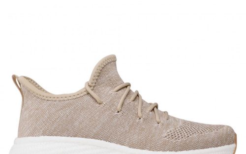 Beige mesh low-top sneaker with white sole, side view, breathable fabric and lace-up design.