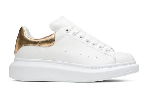 White-Gold Low Top Wide Leather Tennis Shoe with gold heel accent and thick white sole, side view.