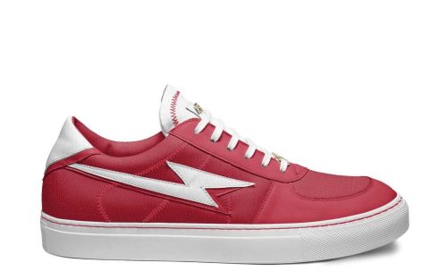 Red Skater 83 sneaker with white lightning bolt design and white sole, perfect for skateboarding enthusiasts.