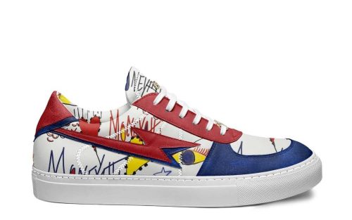 Skater S83 sneaker with bold blue, red, and yellow graffiti-style design on a white leather base.